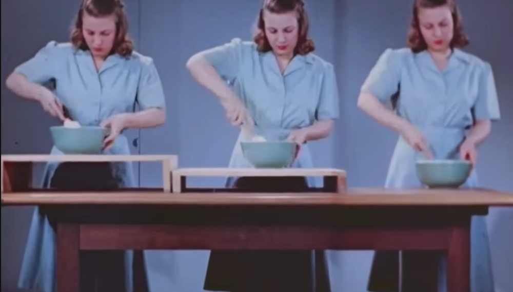 A woman trying different height workspaces in the kitchen