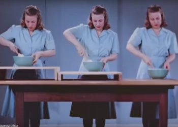 A woman trying different height workspaces in the kitchen