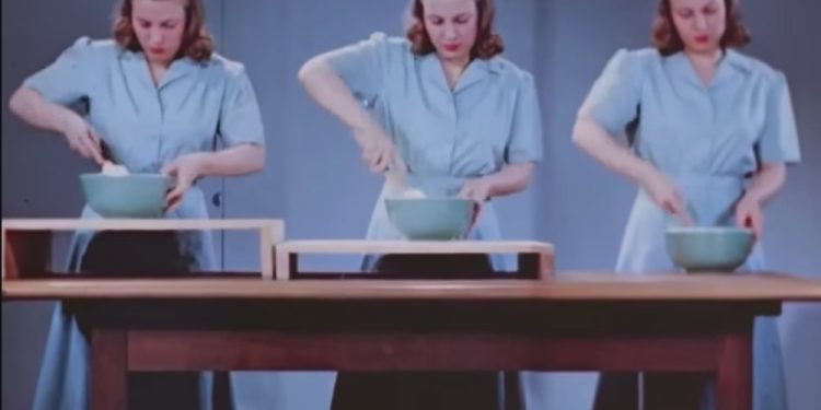 A woman trying different height workspaces in the kitchen