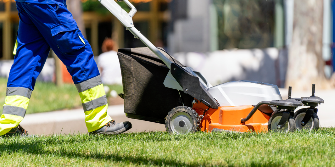 DIY Lawn Care vs. Professional Lawn Services: Pros and Cons Banner Image - Garden worker mowing the lawn