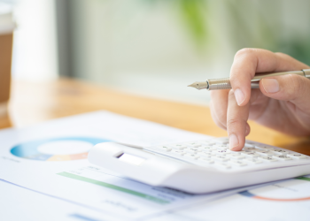 Discovering Cost-Saving Habits: Energy-Efficient Practices for Lower Electricity Bills Banner Image - Calculating Cost Economic budget saving and investment concept analyzing investment charts