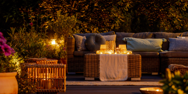 Highlighting Your Garden_ Creating a Magical Nighttime Oasis Banner Image - Trendy furniture, lights, lanterns and candles in the garden at night