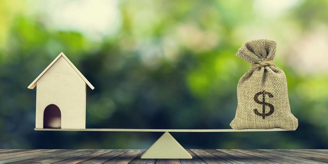 Money and home,loan,mortgage. Change home into cash concept.