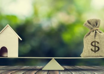 Money and home,loan,mortgage. Change home into cash concept.