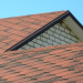 Top Benefits of Investing in a New Roof Banner Image - The roof is covered with bituminous shingles of brown color. Quality Roofing