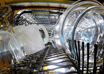 a fully stacked dishwasher full of safe products