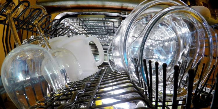 a fully stacked dishwasher full of safe products