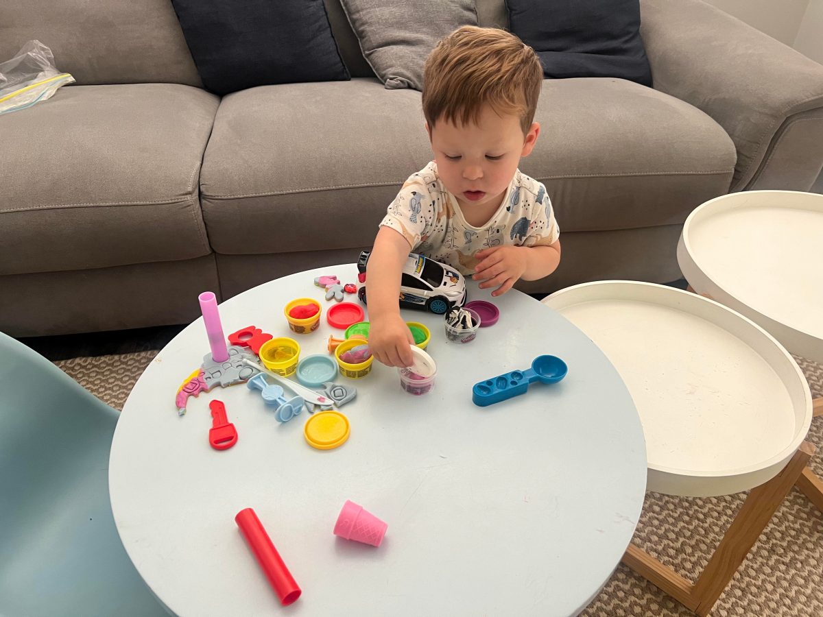 boy playing with playdoh