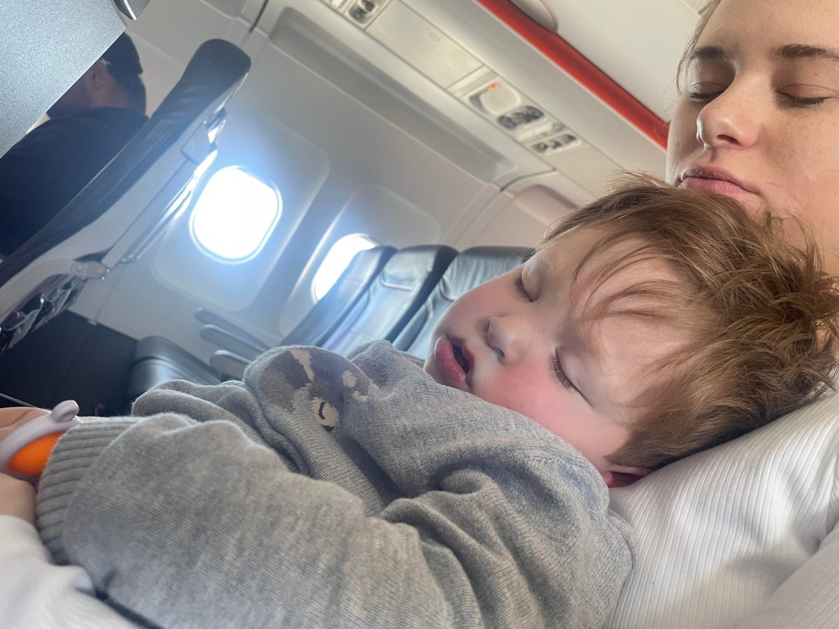 boy taking nap on the plane