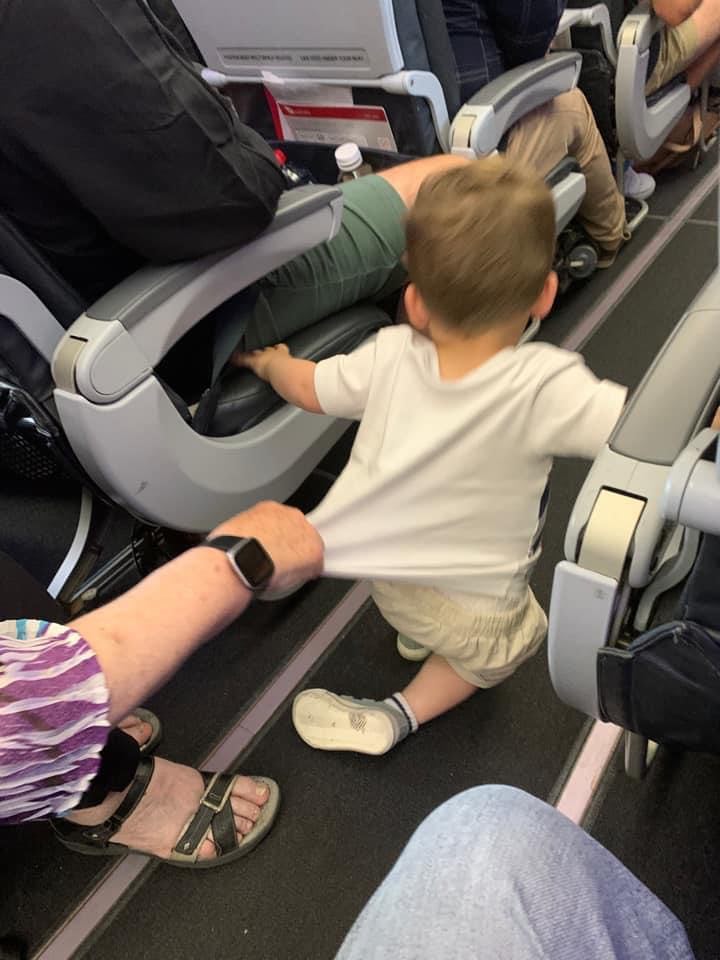 child running around on plane