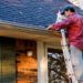 Man Cleaning Gutters on Ladder