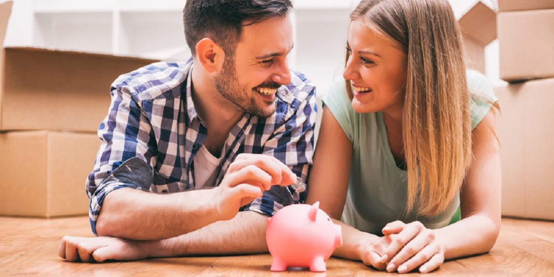 young couple saving money for new home