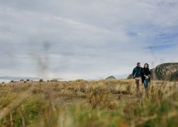 Young couple taking a walk near the coast