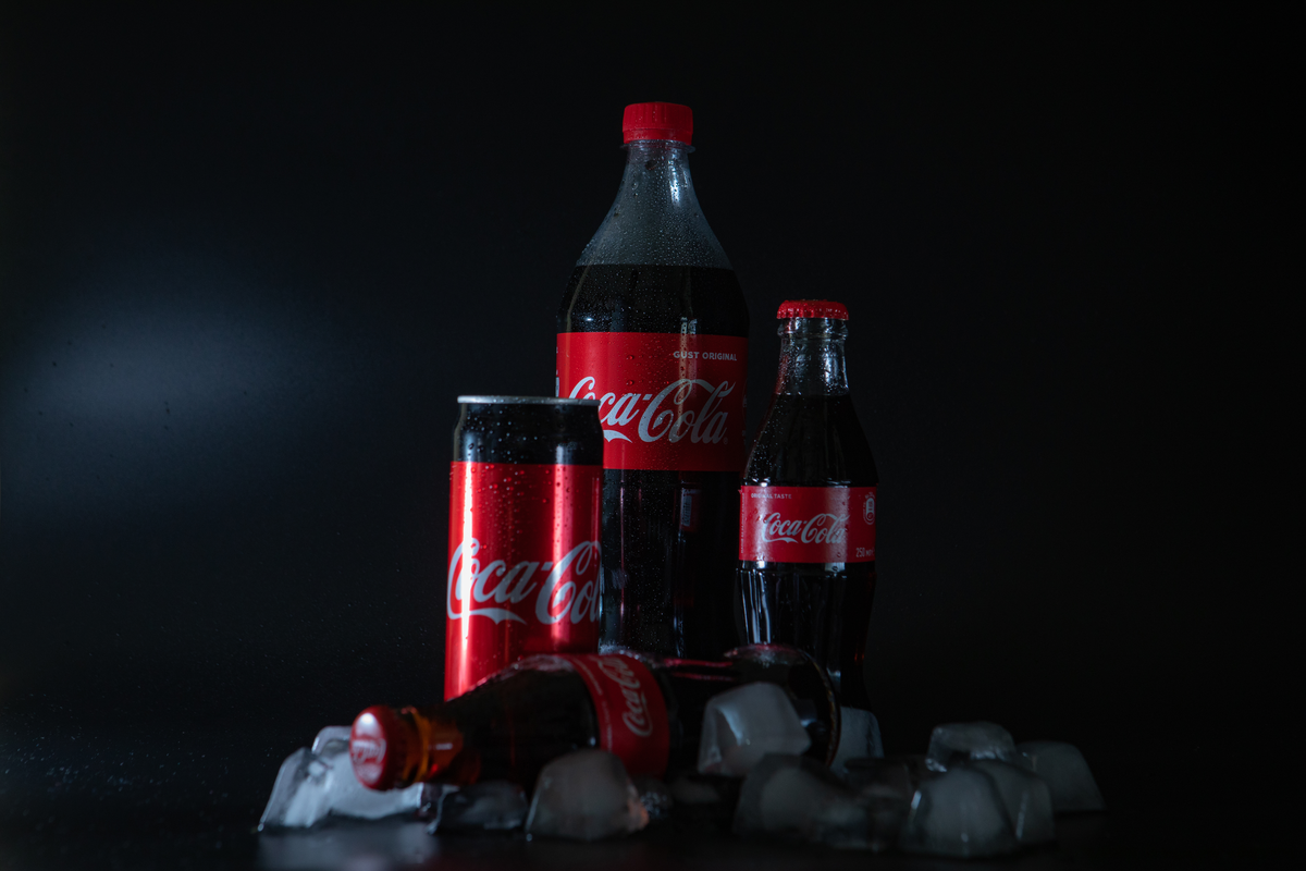 different size coca cola bottles