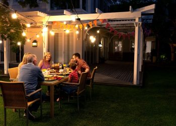 family at a pergola eating food