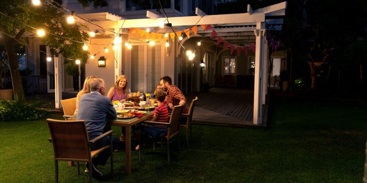 family at a pergola eating food