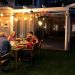 family at a pergola eating food