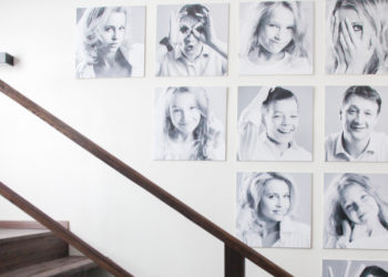 black and white family photos by stairs