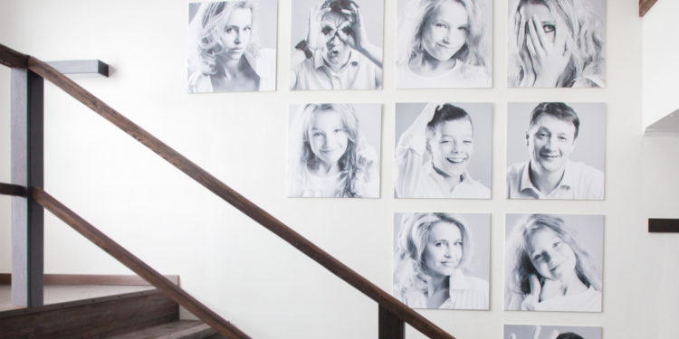 black and white family photos by stairs