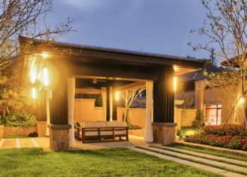 house with outdoor lighting at dusk