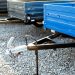 Farm truck trailer on the open ground of the agricultural shop