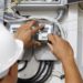 Electrician is repairing and checking electric meters. Close up. Selective focus.