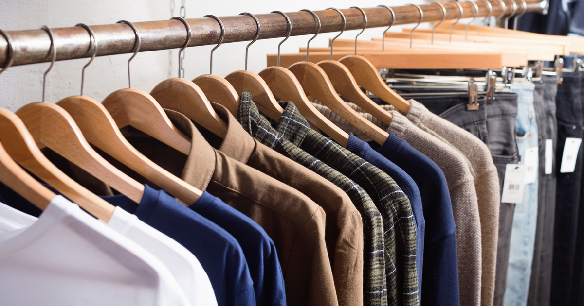 mens shirts hanging in wardrobe