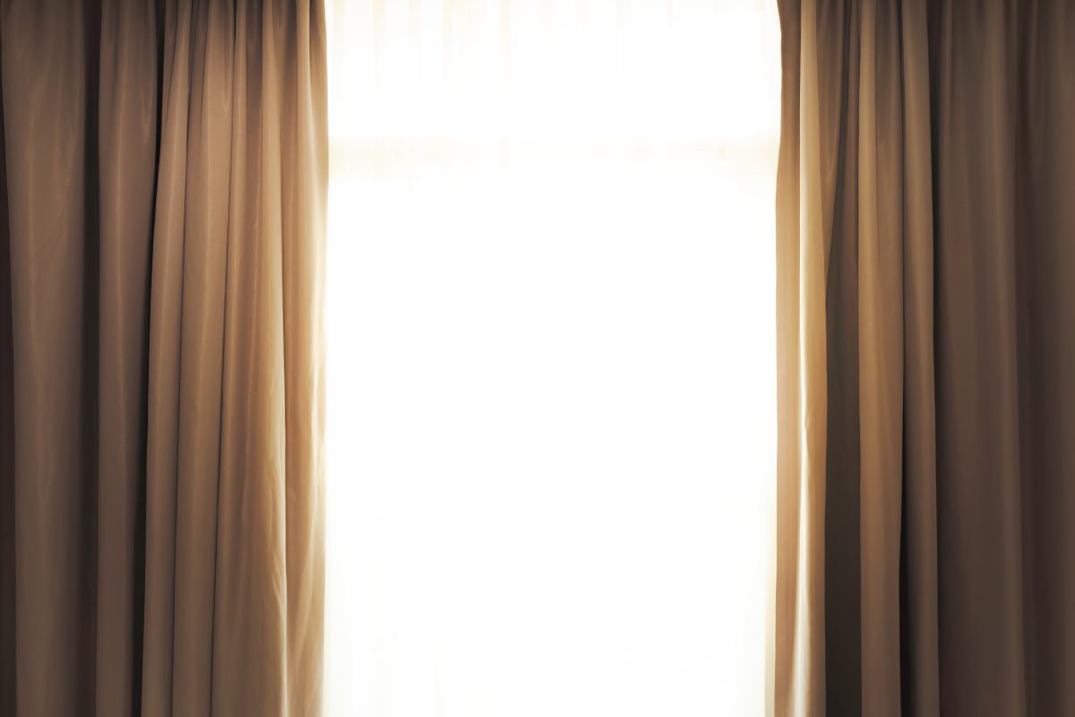 open curtains with sunlight through