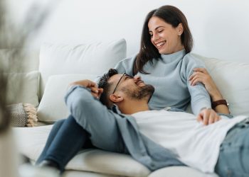 people relaxing at home on the coach