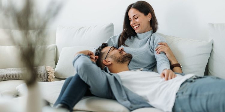 people relaxing at home on the coach
