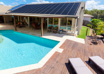 poolside home with solar panels