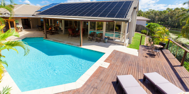 poolside home with solar panels