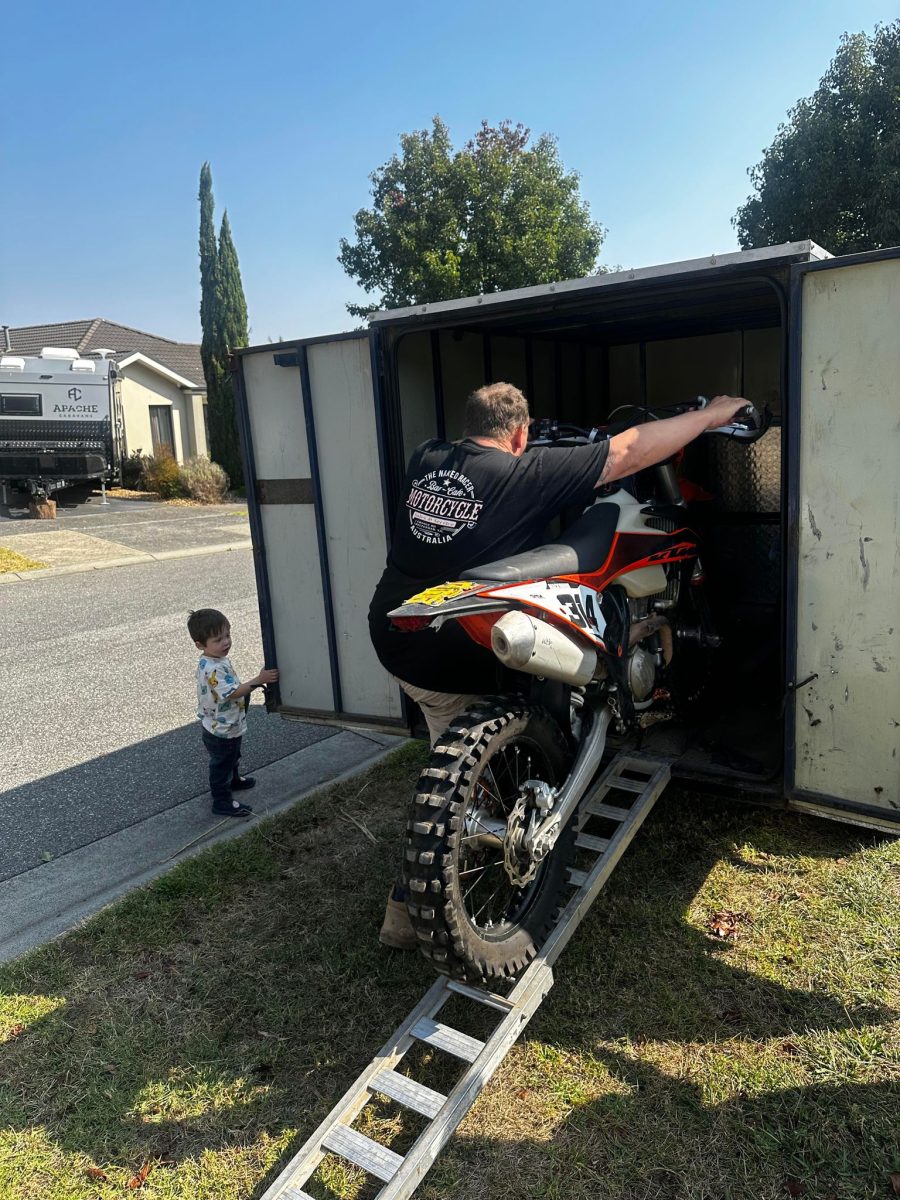 putting poppys dirt bike in the trailer