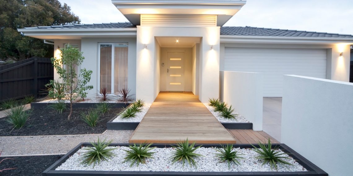 Facade and entry to a contemporary white rendered home in Australia