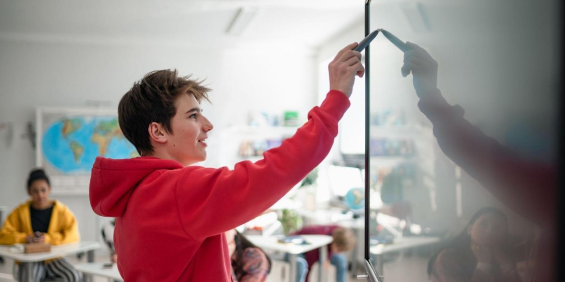 teacher writing on the whiteboard