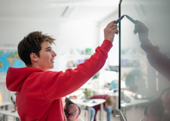 teacher writing on the whiteboard