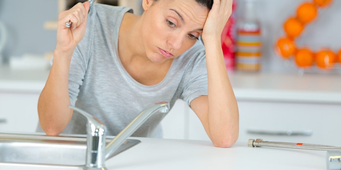 woman looking at sink