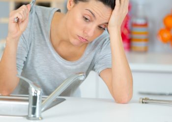 woman looking at sink