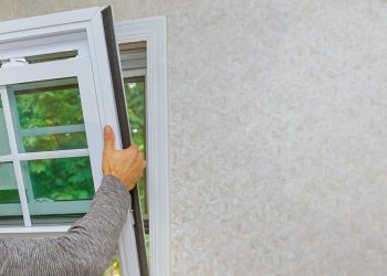 Worker in the installing new, windows in an house new window in the home renovation living energy efficiency