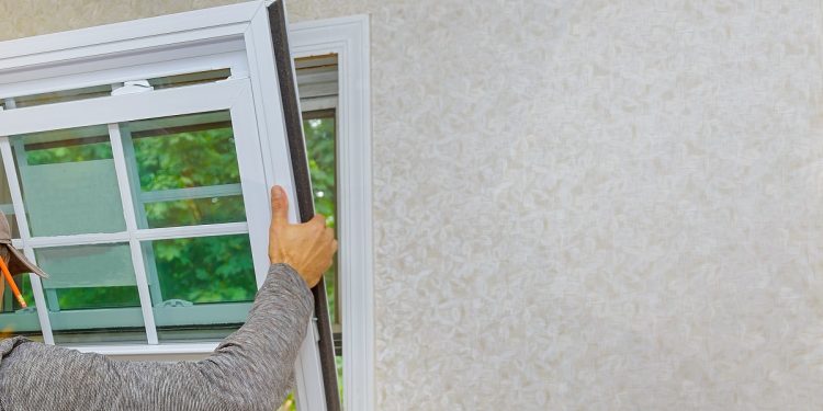 Worker in the installing new, windows in an house new window in the home renovation living energy efficiency